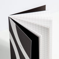 A close-up image of an opened Folio Notebook on a white background.