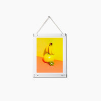 Acrylic Poster Hanger Frame in Small with poster on a white background.