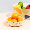 Bamboo Bowl Set in Stripes with oranges in it 