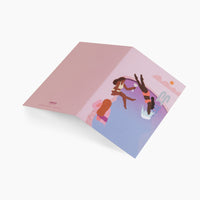 Bestie Trip Card opened on a grey background. 