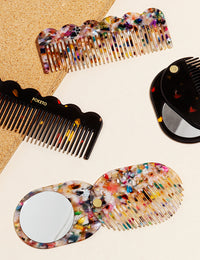 Various combs and mirrors in different shapes & colors