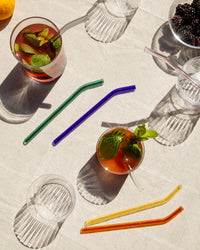 Poketo Glass Straw in Cool in a picnic setting 