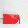 Poketo Red Curve Clutch on a white background. 