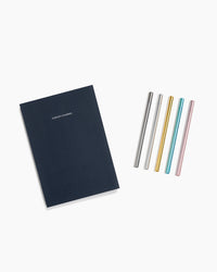 The Midnight Concept Planner and Prism Roller ball pen set on a white background. 