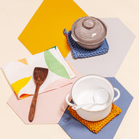 Hexagon Placemat in Marigold, gray, cornflower, and pink with pots