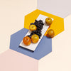 Hexagon Placemat in Marigold, gray, cornflower, and pink
