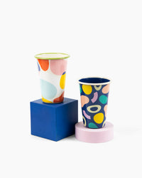 The Poketo x Crow Crayon Tumbler in Sea Glass next to the Tumbler in Outlines and Boulderson a white background. 
