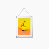 Acrylic Poster Hanger Frame in Small with poster on a white background. 