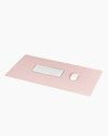 Minimalist Desk Mat in Blush with a keyboard and mouse on a white background. 