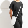 Phone Crossbody in gray on a model